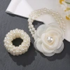 The new pearl hair band exudes a light luxury and trendy Korean style. It features a small flower-shaped female ponytail band headwear and a leather band hair tie Specification image